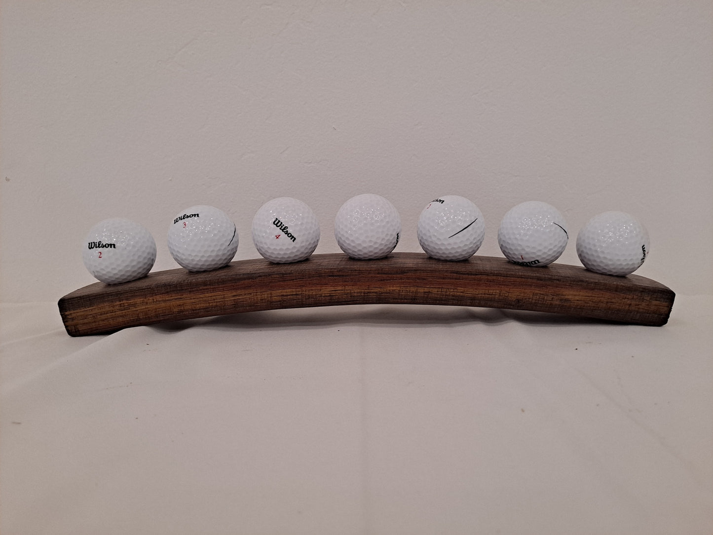Golf ball holder from stave