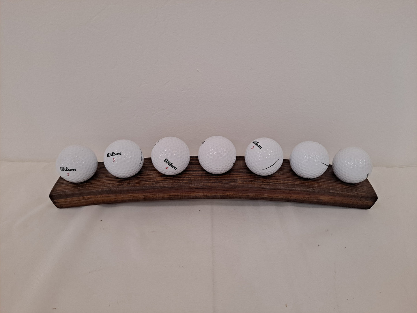 Golf ball holder from stave